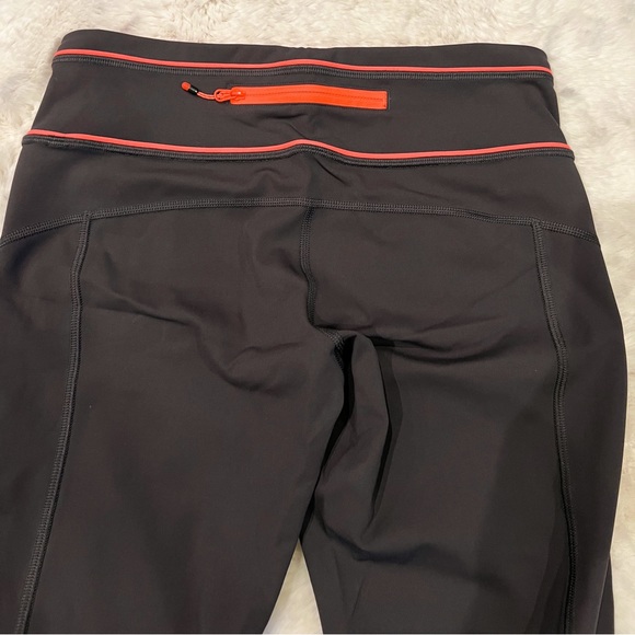 Lululemon capris. Like new. Barely worn. Size 6. Dark grey with coral. - Picture 5 of 10